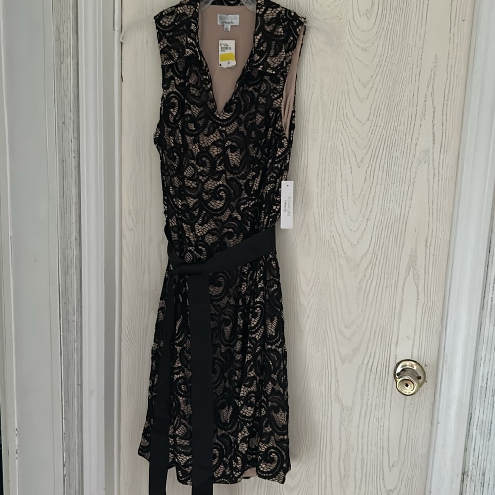 Semiformal black lace dress with beige underlay.